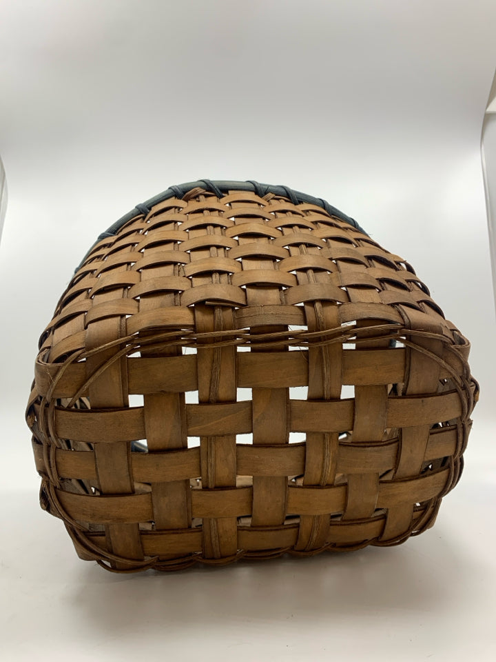 OVAL WOVEN BASKET W/BLUE RIM.