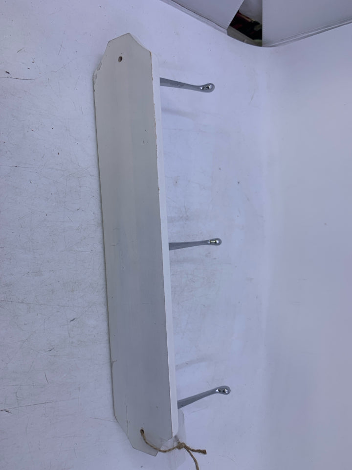 PAINTED WHITE WOOD BASE W/ 3 SILVER HOOKS WALL HANGING.
