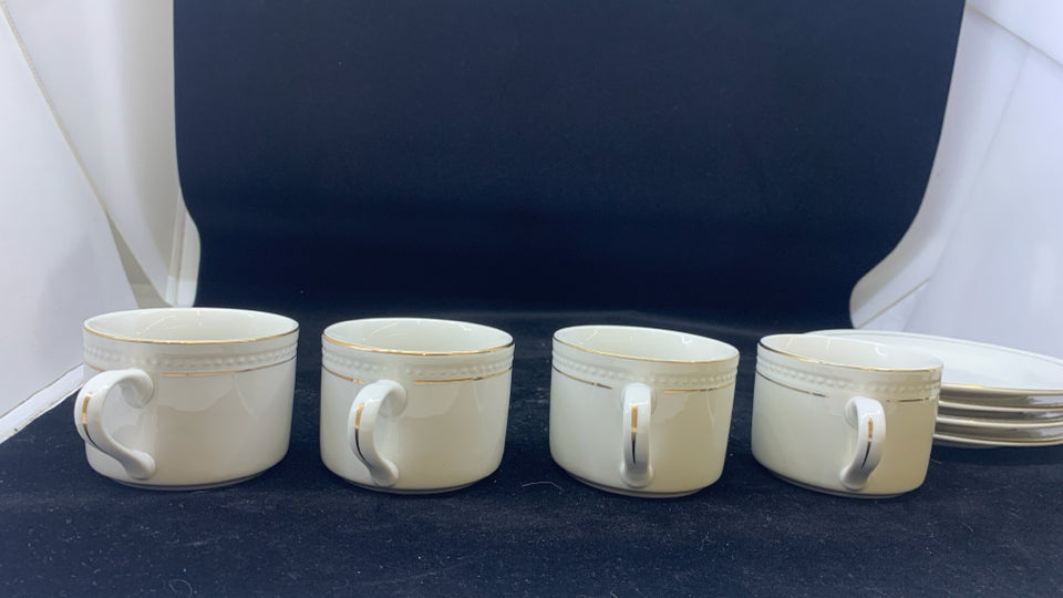 4 CREAM CUPS + SAUCERS- CREAM W/GOLD RIM.