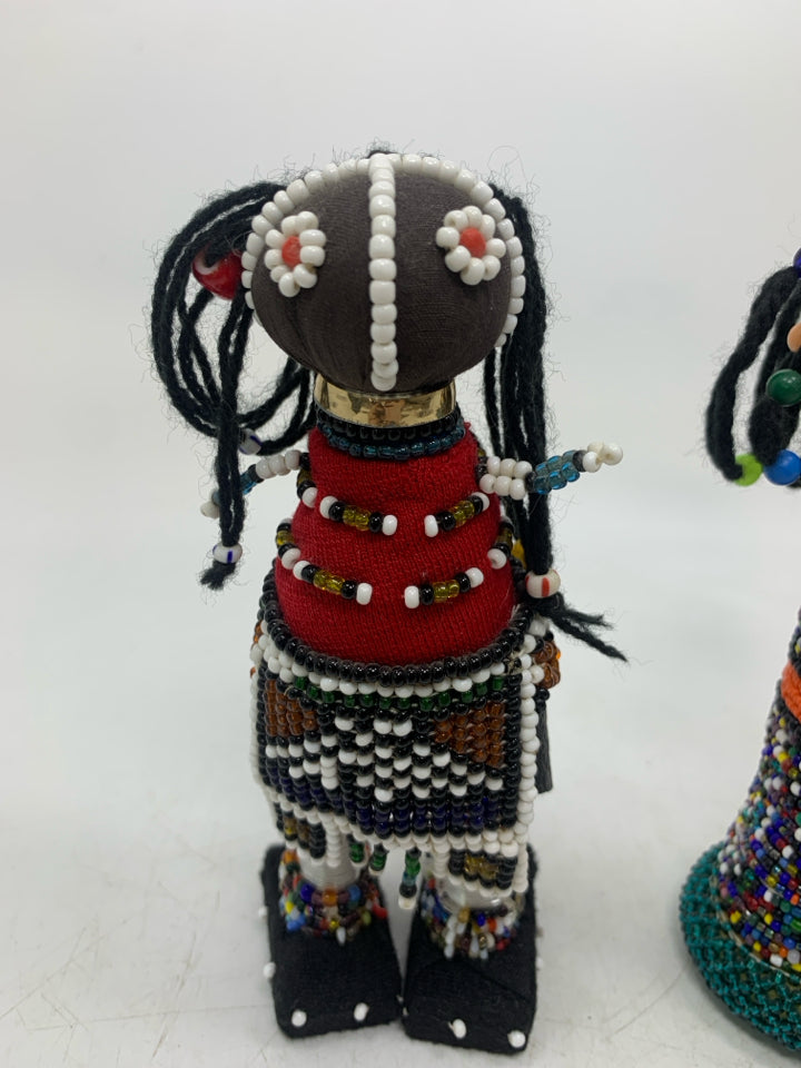 2 BEADED FOLK ART DOLLS.