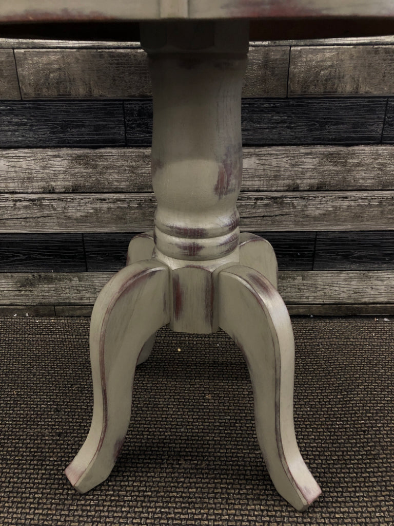 OVAL GREEN TINT DISTRESSED FOOTED SIDE TABLE.