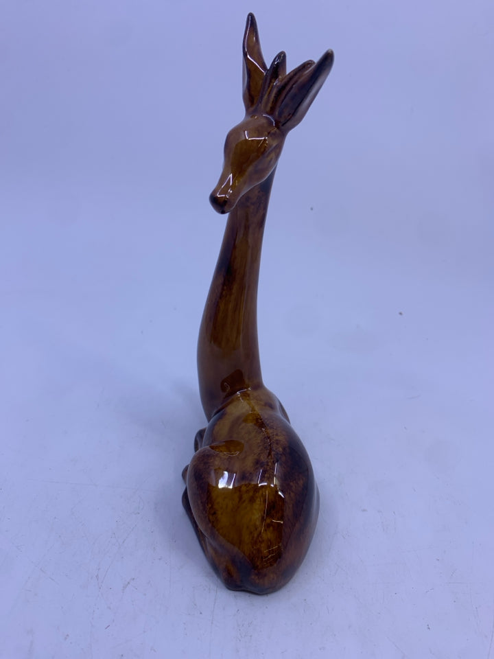 BROWN GIRAFFE LAYING DOWN FIGURE.