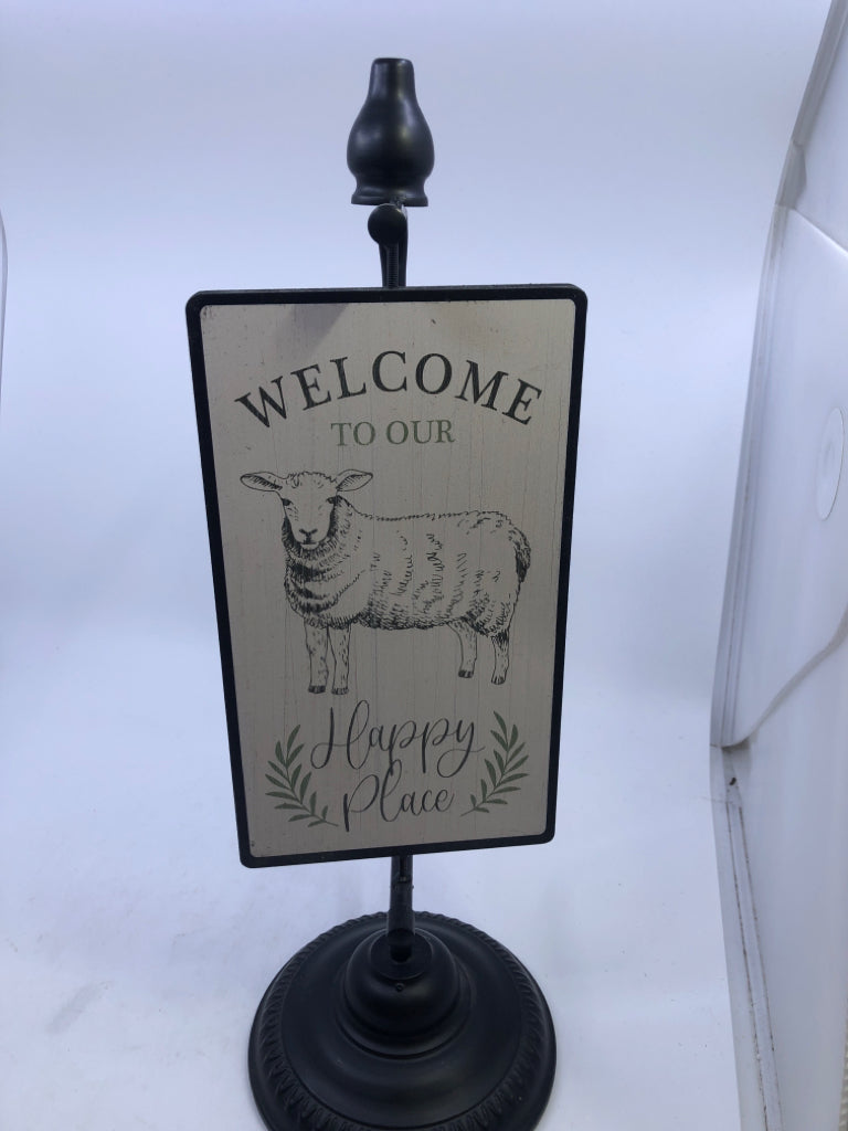 2-SIDED SIGN WELCOME TO OUR HAPPY PLACE SHEEP W/BLACK METAL BASE.