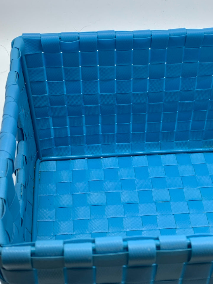 TEAL WOVEN RECTANGLE STORAGE BASKET.