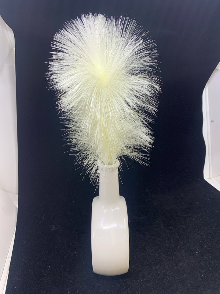FAUX PAMPAS PLANT IN WHITE OVAL VASE.