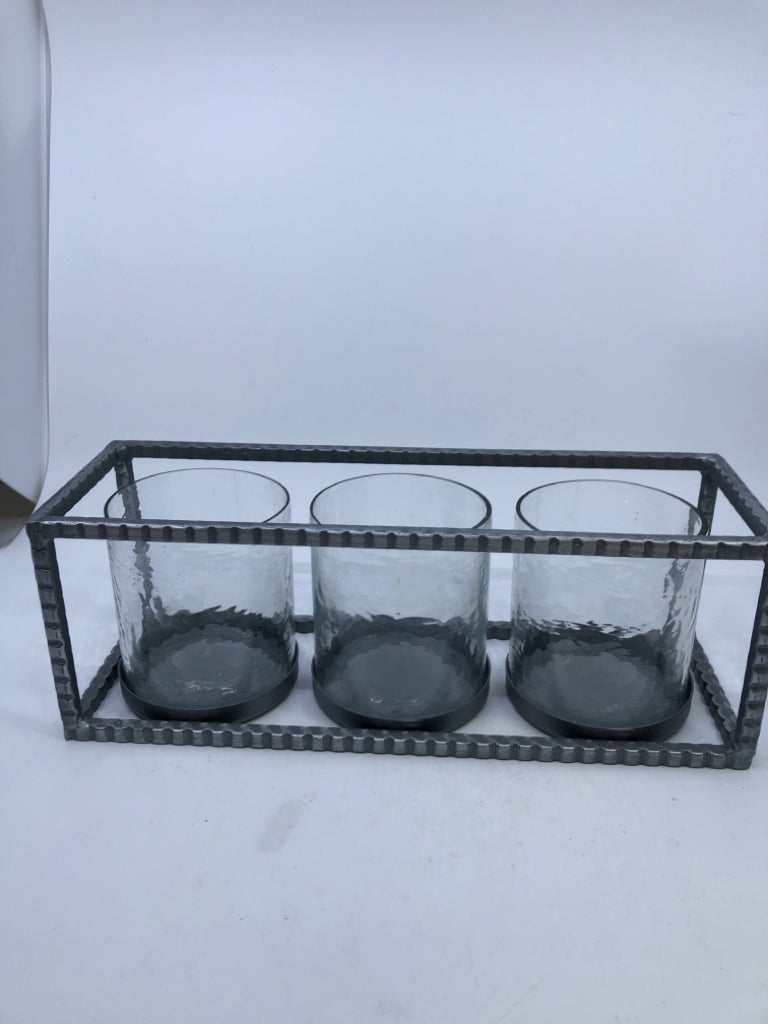 3 CANDLE HOLDERS IN METAL HOLDER.