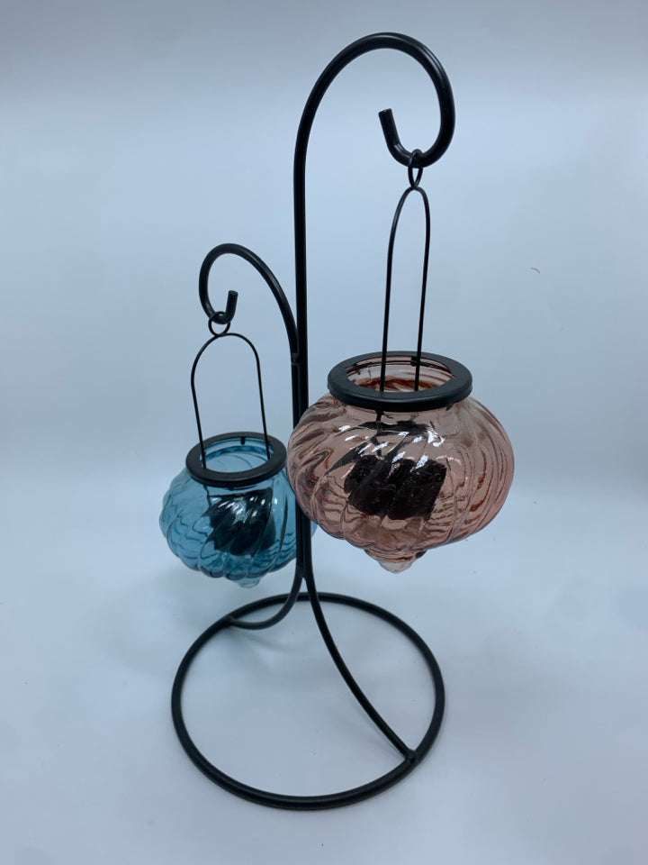 METAL TEA LIGHT HOLDER W/BLUE AND PINK GLASS VOTIVE GLOBES.