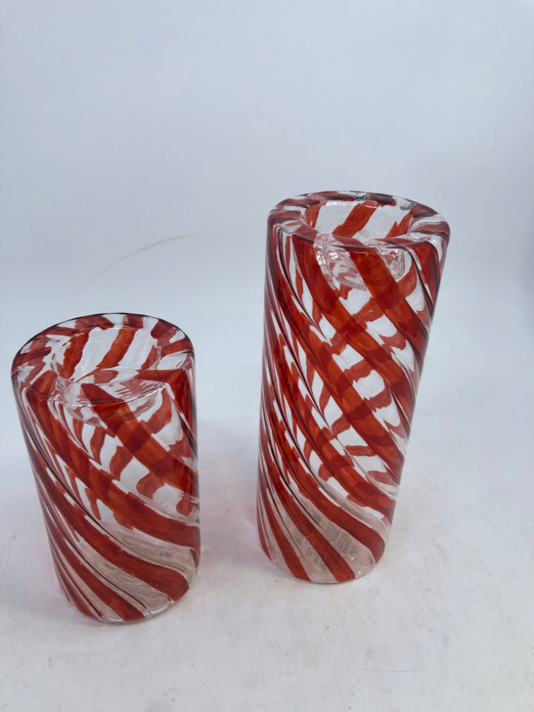 2 GLASS RED SWIRL CANDLE HOLDERS.