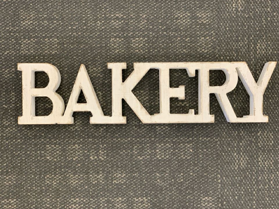WHITE BAKERY SIGN.