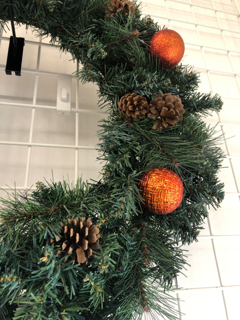 CHRISTMAS PINECONE AND RED ORNAMENT WREATH.