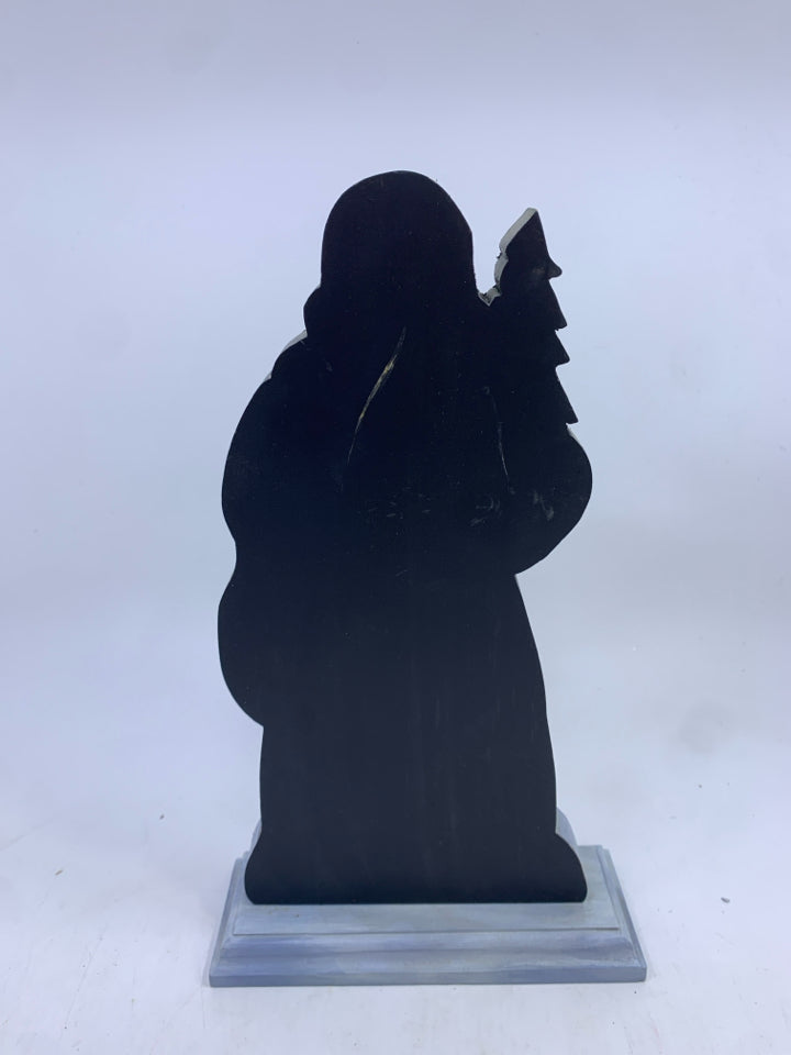 WOOD SANTA ON STAND GREEN COAT HOLDING TOYS.