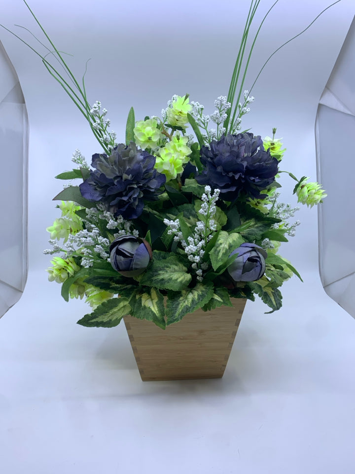 FAUX BLUE AND GREEN FLORAL IN WOOD FLARED TOP PLANTER.