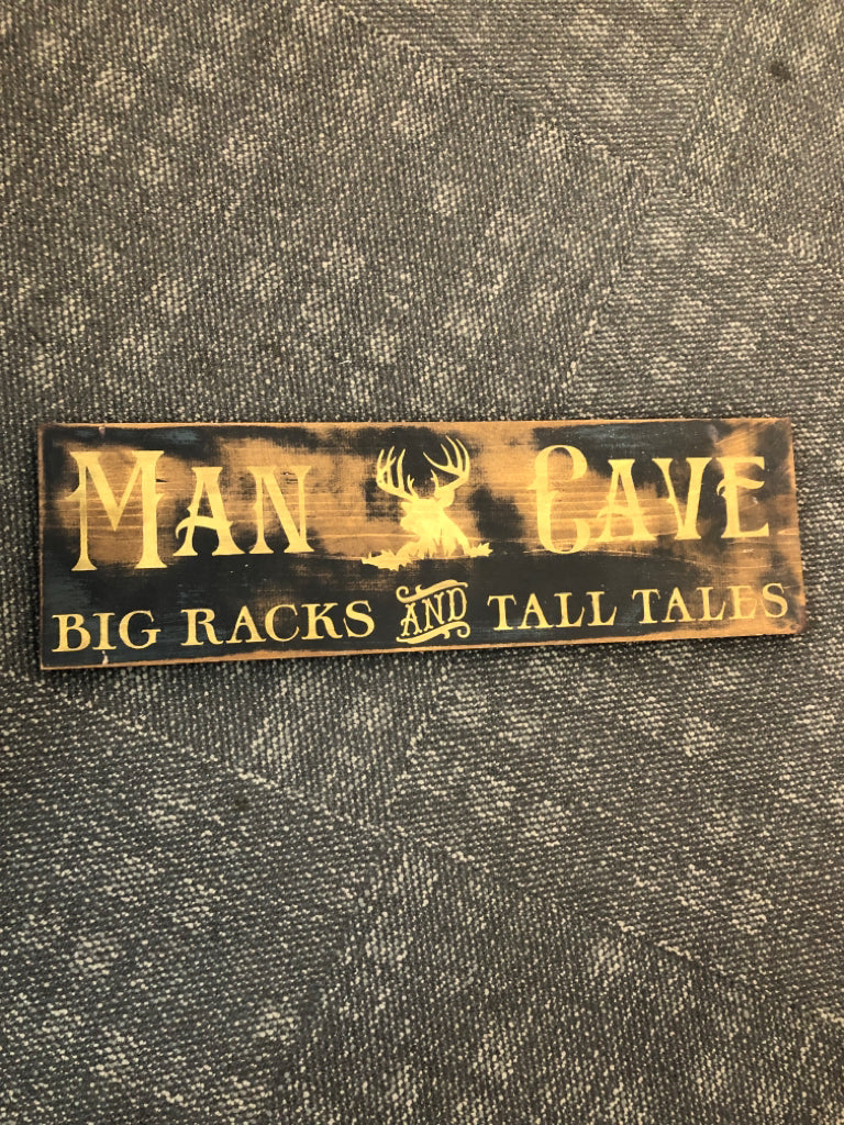 WOODEN MAN CAVE SIGN.
