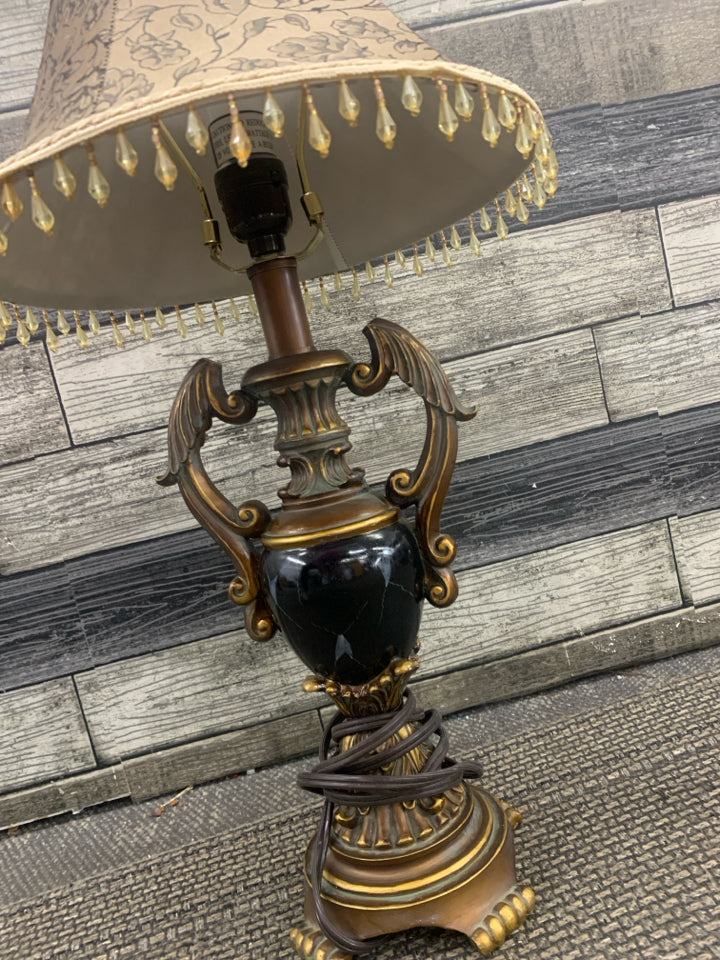 BLACK MARBLE ORNATE LAMP WITH TAN FLORAL SHADE W/ BEADS.