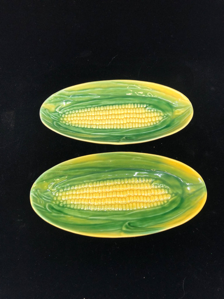 2 VTG CORN ON THE COB BUTTER PLATES.