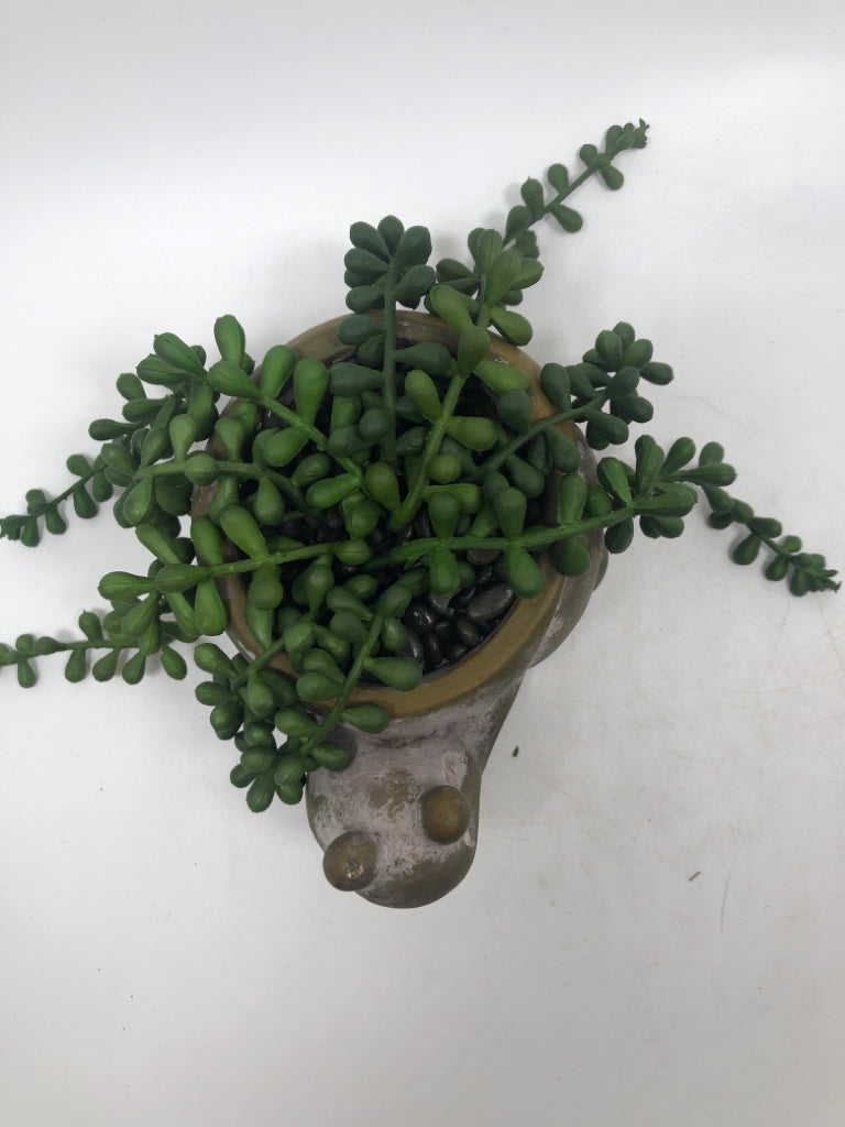FAUX GREENERY IN SNAIL PLANTER.