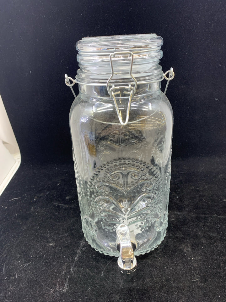 EMBOSSED CLEAR GLASS DRINK DISPENSER.