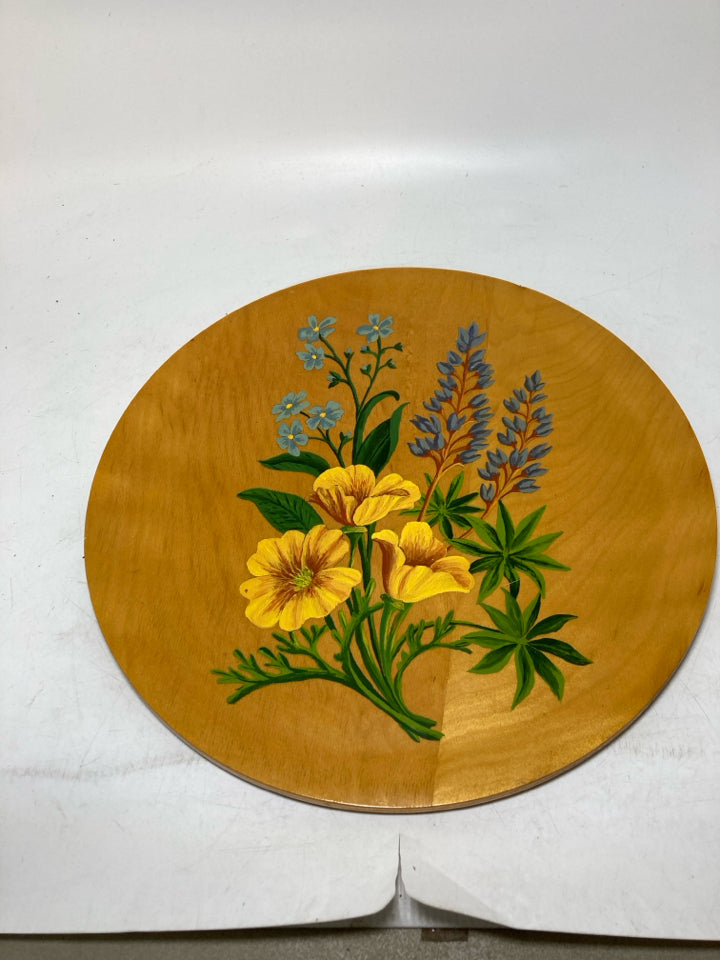 WOOD GLAZED CIRCLE W/ PLANTED FLOWERS.