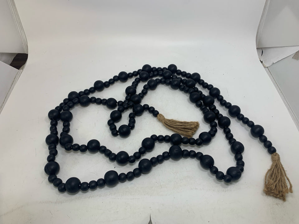 BLACK BEADS W/ TASSELS GARLAND.