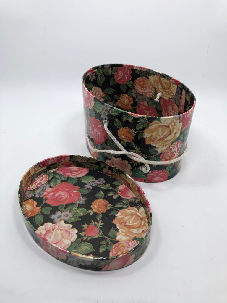 OVAL FLORAL GIFT BOX W/WHITE ROPE HANDLE.