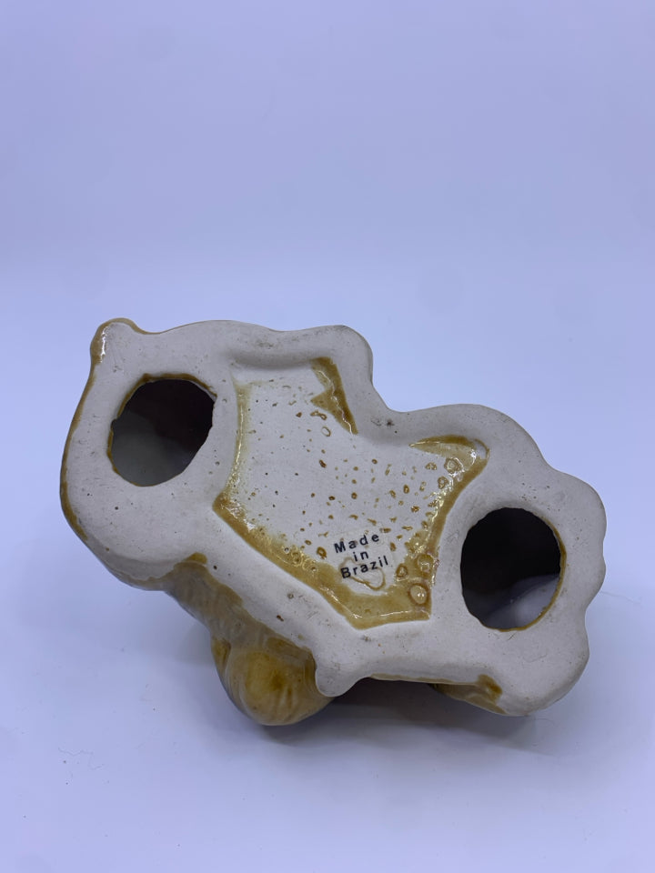 CERAMIC SLEEPING DOG FIGURE.