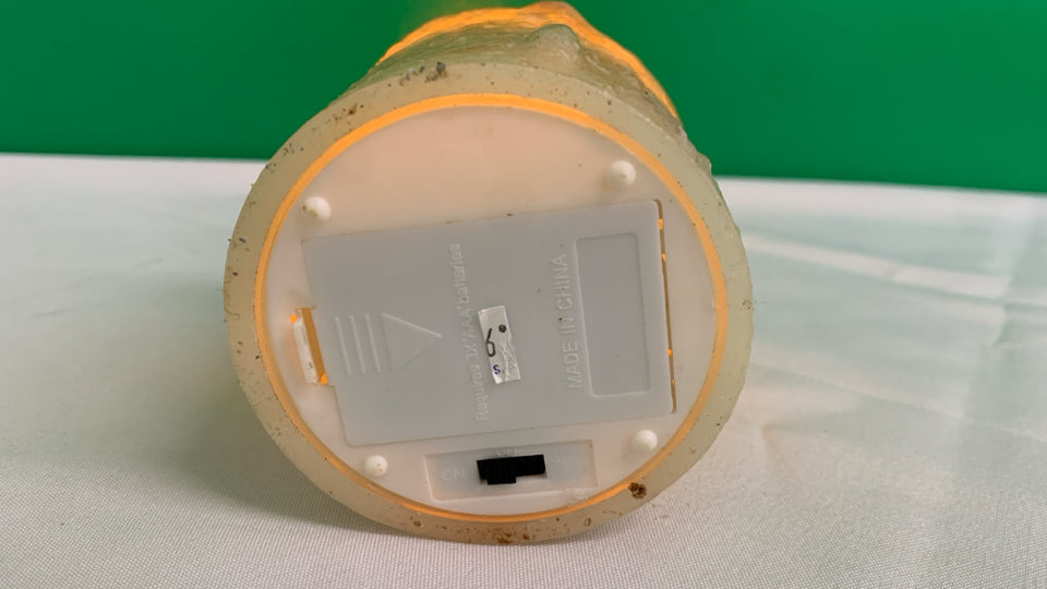 FAUX LIGHT UP BATTERY CANDLE.