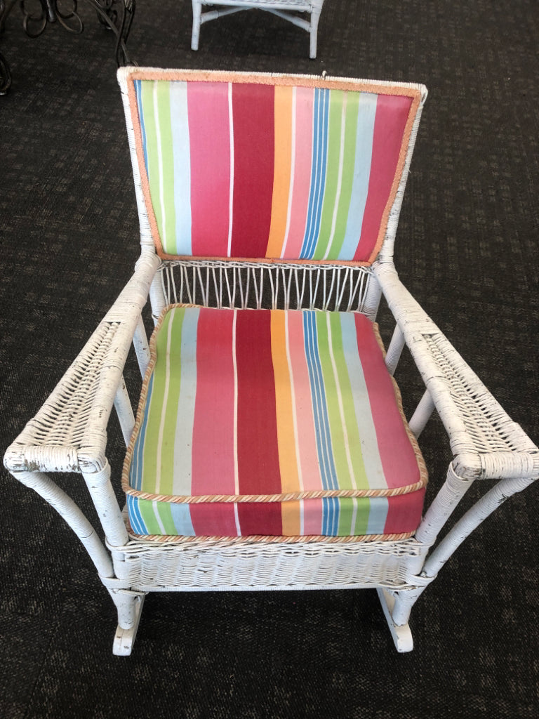 VTG WHITE WICKER ROCKING CHAIR W/ COLORFUL UPHOLSTERED BACK/CUSHION.