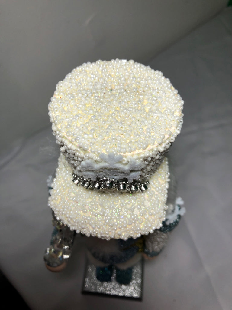 LIGHT BLUE AND WHITE SNOWFLAKE NUT CRACKER.