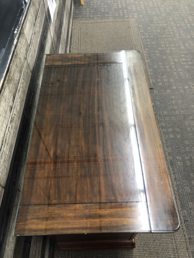 DARK CHERRY SIDE TABLE W/VTG METAL HANDLES & GLASS COVER ON WHEELS.