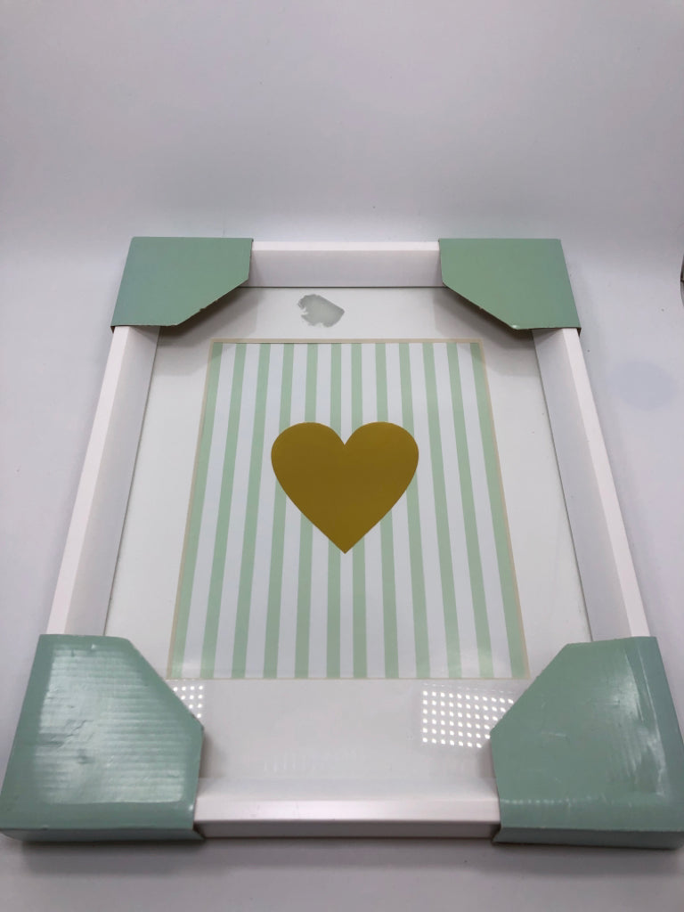 GOLD HEART IN WHITE WOOD FRAME WALL HANGING.