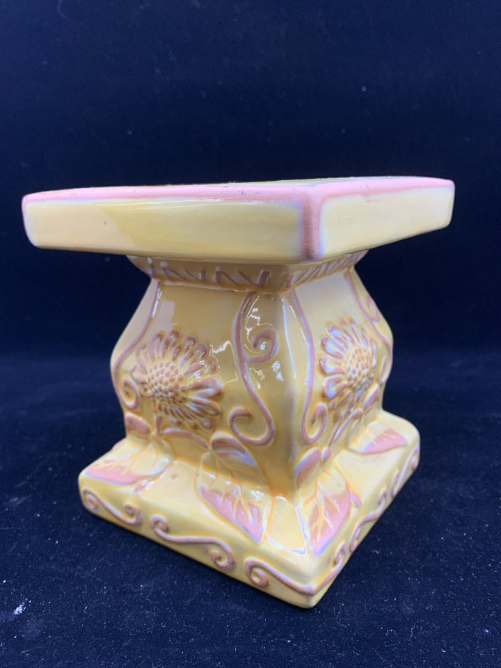 YELLOW, PINK, WHITE FLORAL DESIGN CANDLE PEDESTAL.