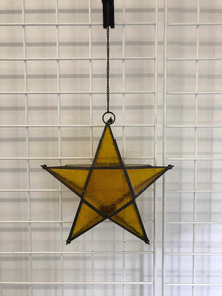 HANGING YELLOW STAR CANDLE HOLDER.