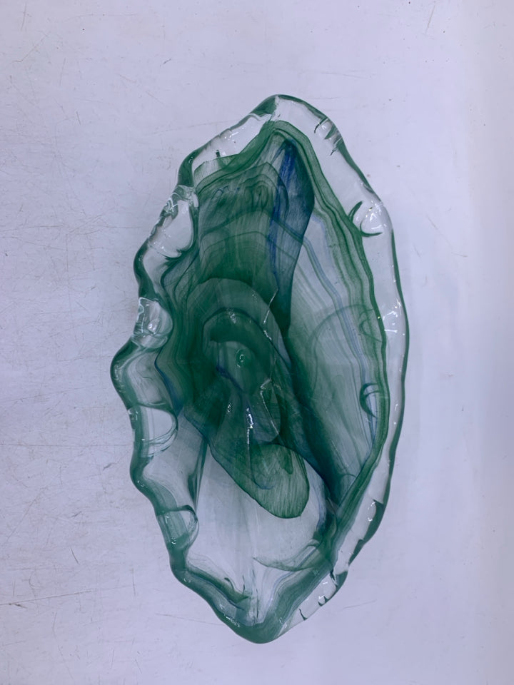 ABSTRACT OVAL GLASS W/ GREEN SWIRLS.