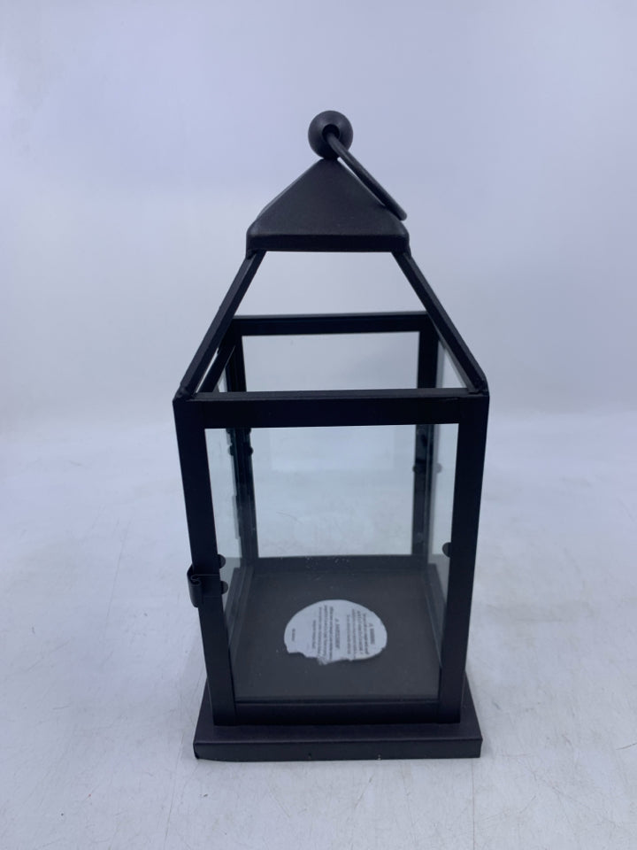 BROWN METAL TEA LIGHT HOLDER LANTERN.
