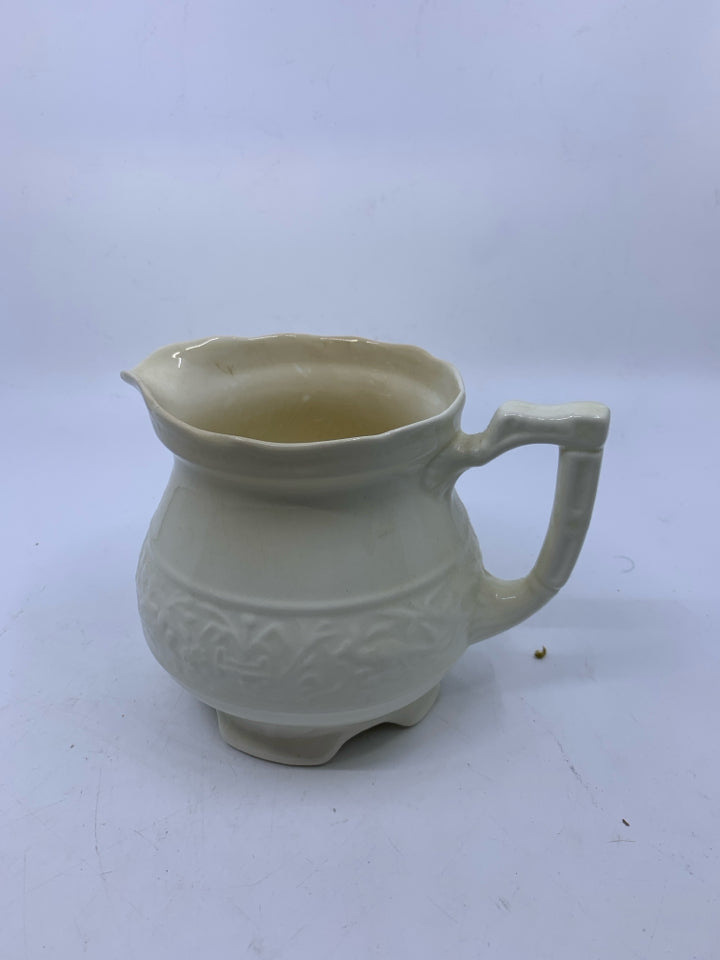 SMALL EMBOSSED PITCHER.