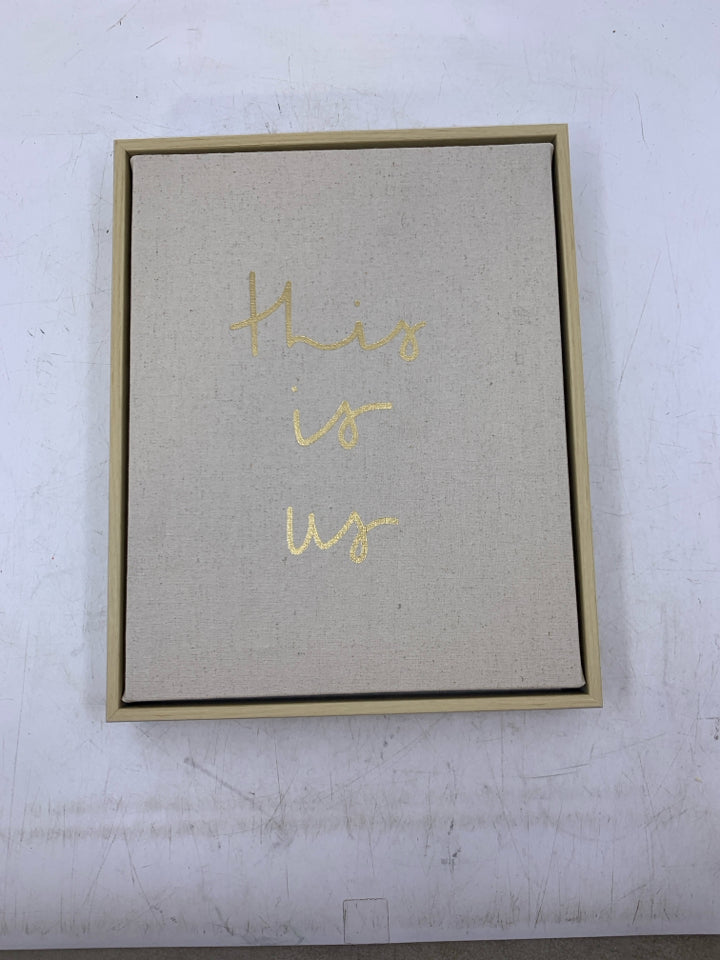 THIS IS US IN GOLD WRITING FRAMED CANVAS.