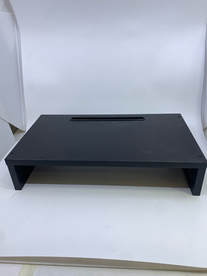 BLACK COMPUTER RISER W/CORD SLOTS.