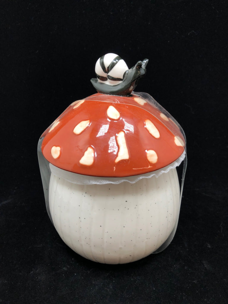 NIP SNAIL ON MUSHROOM SPECKLED CANISTER.