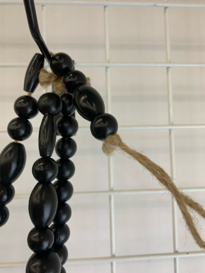 BLACK WOODEN BEADED GARLAND.