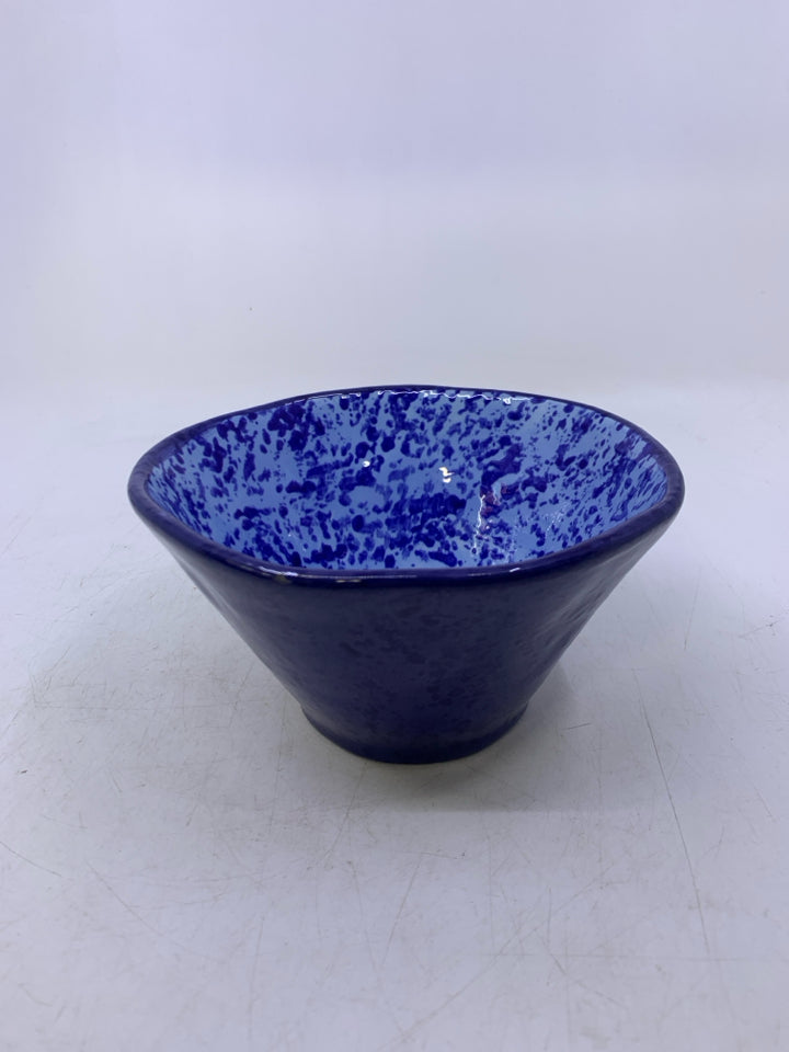 DARK BLUE CERAMIC BOWL W/ BLUE DOTS INSIDE.