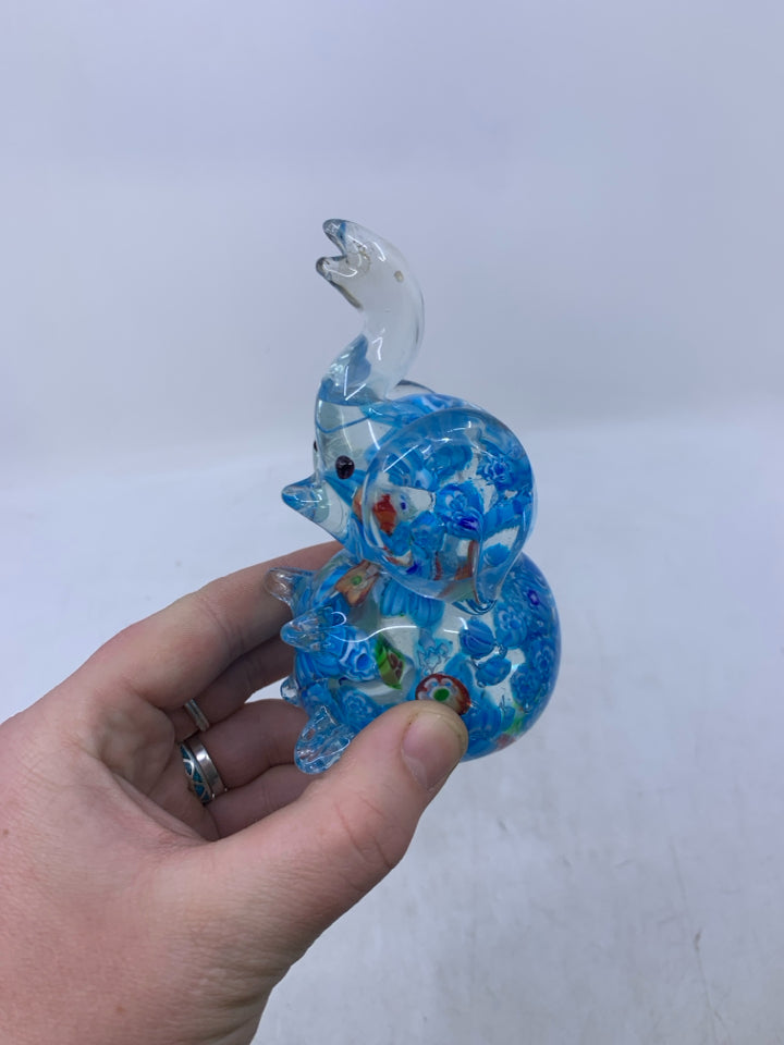 BLUE SITTING ELEPHANT W/ TRUNK UP.