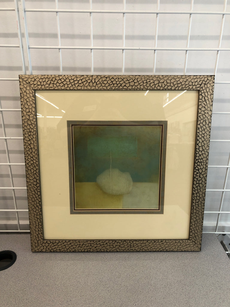 TEAL/CREAM ABSTRACT PRINT IN GOLD PAINTED FRAME.