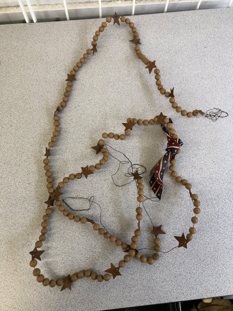 PRIMITIVE BEADED WIRE GARLAND W/BOW.