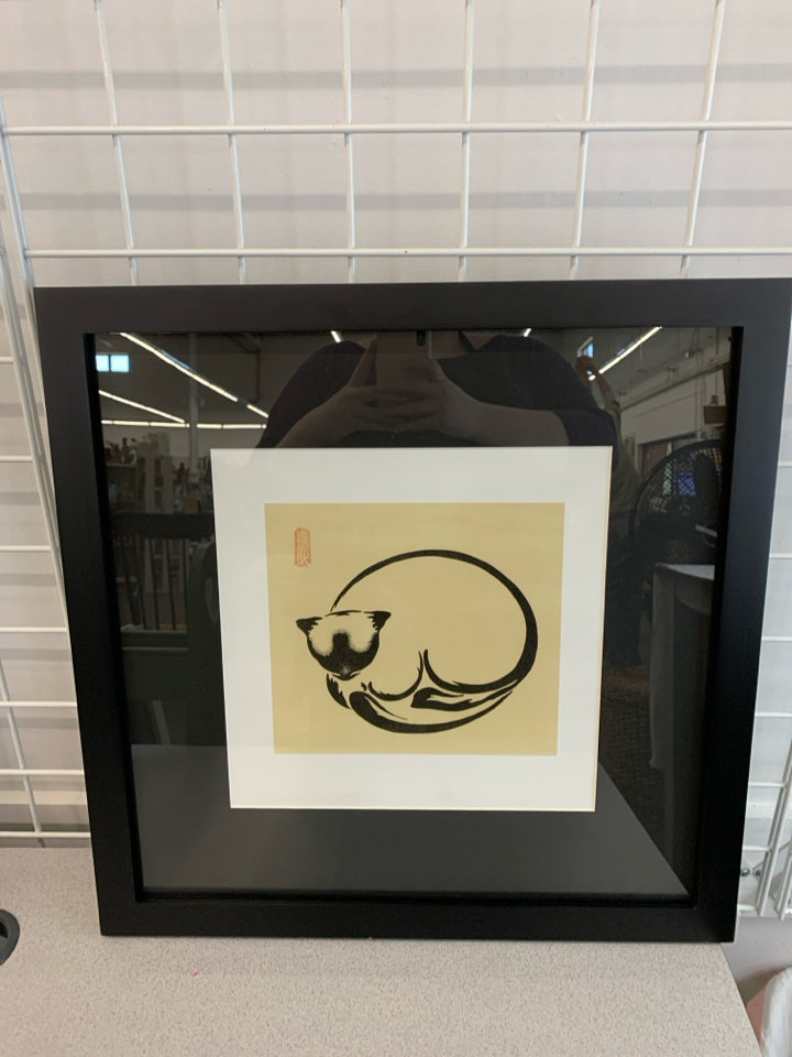 SLEEPING CAT DRAWING IN BLACK FRAME.