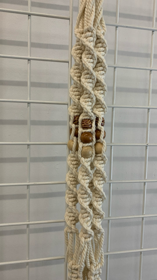BEADED MACRAME PLANT HOLDER.