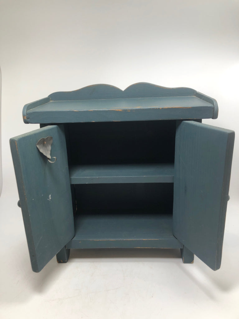 MINI BLUE WOODEN CABINET W/ 2 SHELVES.