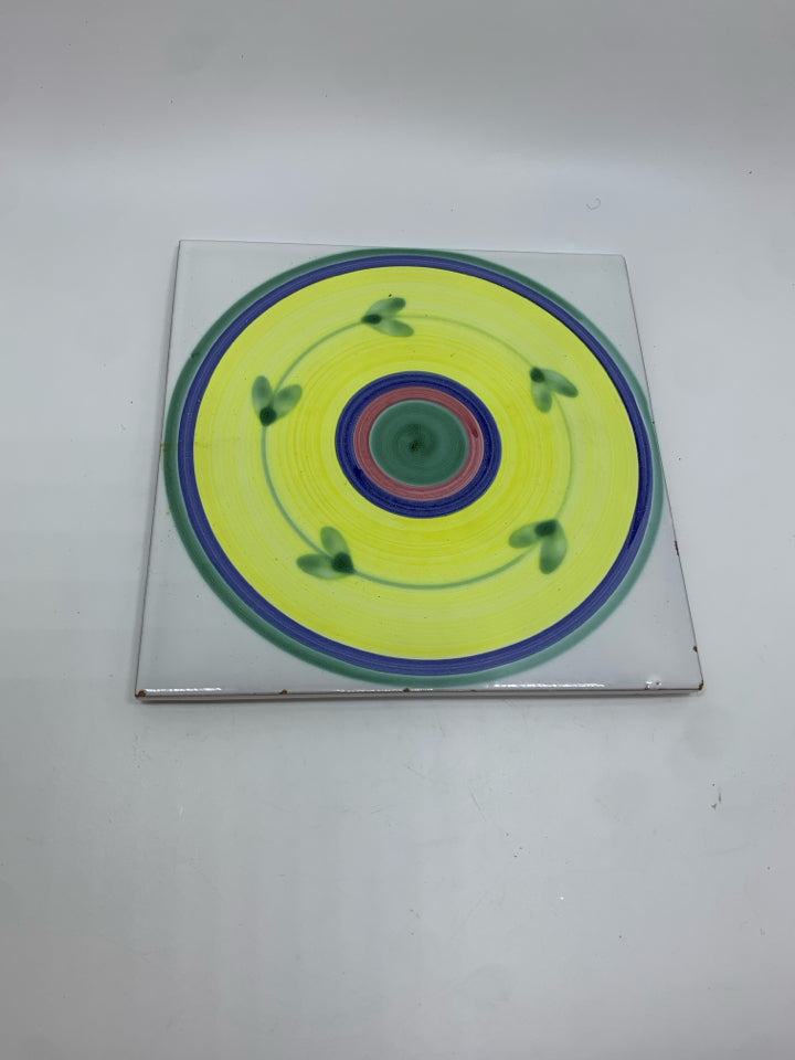 CALECA YELLOW CAROUSEL TRIVET.
