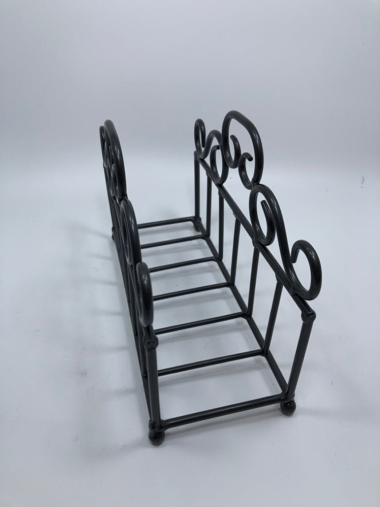 METAL SCROLL NAPKIN HOLDER.