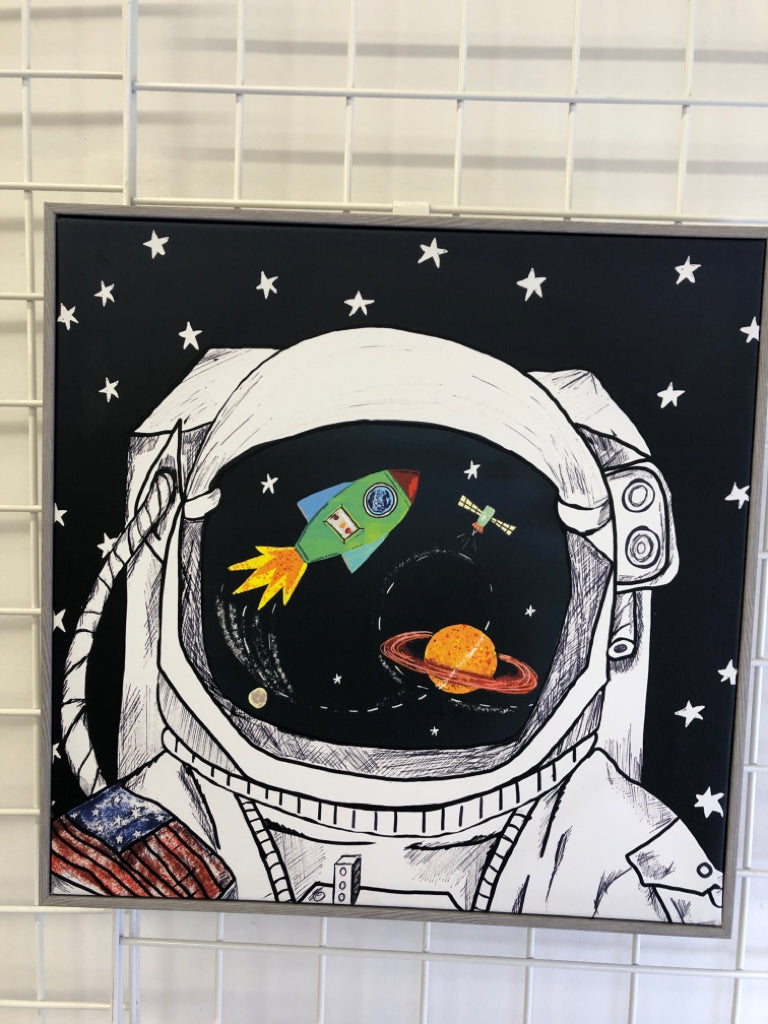 ASTRONAUT CANVAS IN GREY WOOD FRAME.
