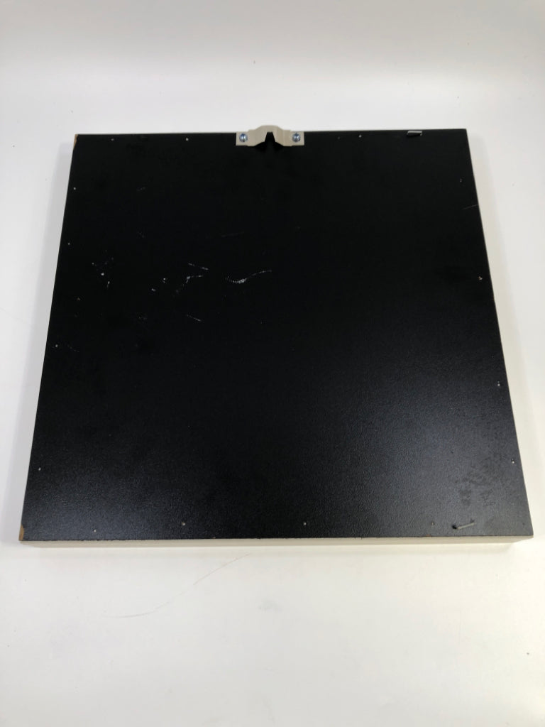 WHITE FLOWER IN GREY SHADOWBOX FRAME.